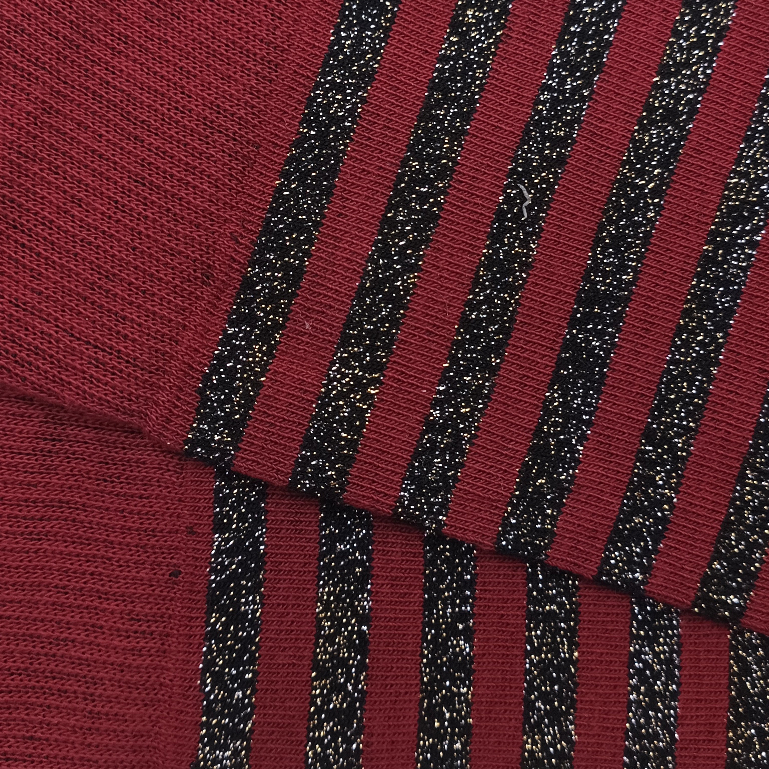 High-waisted, shiny, fine-striped, black and burgundy.